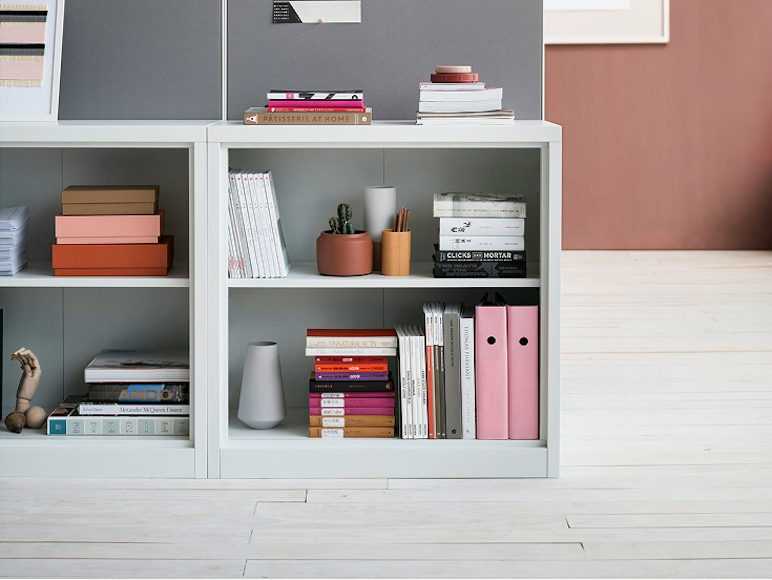 A close-up of a high-cabinet pin board attached to two mid-height CK2 Storage cabinet