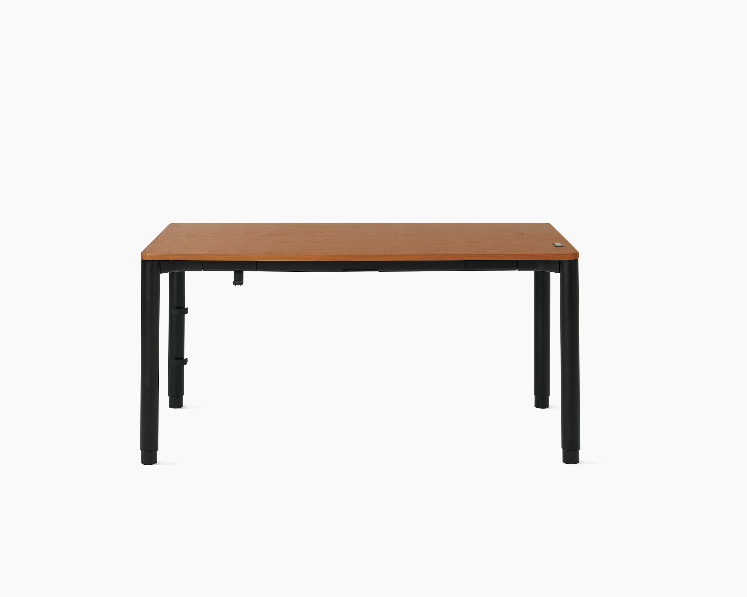 Four leg height-adjustable table with a woodgrain surface and black legs.