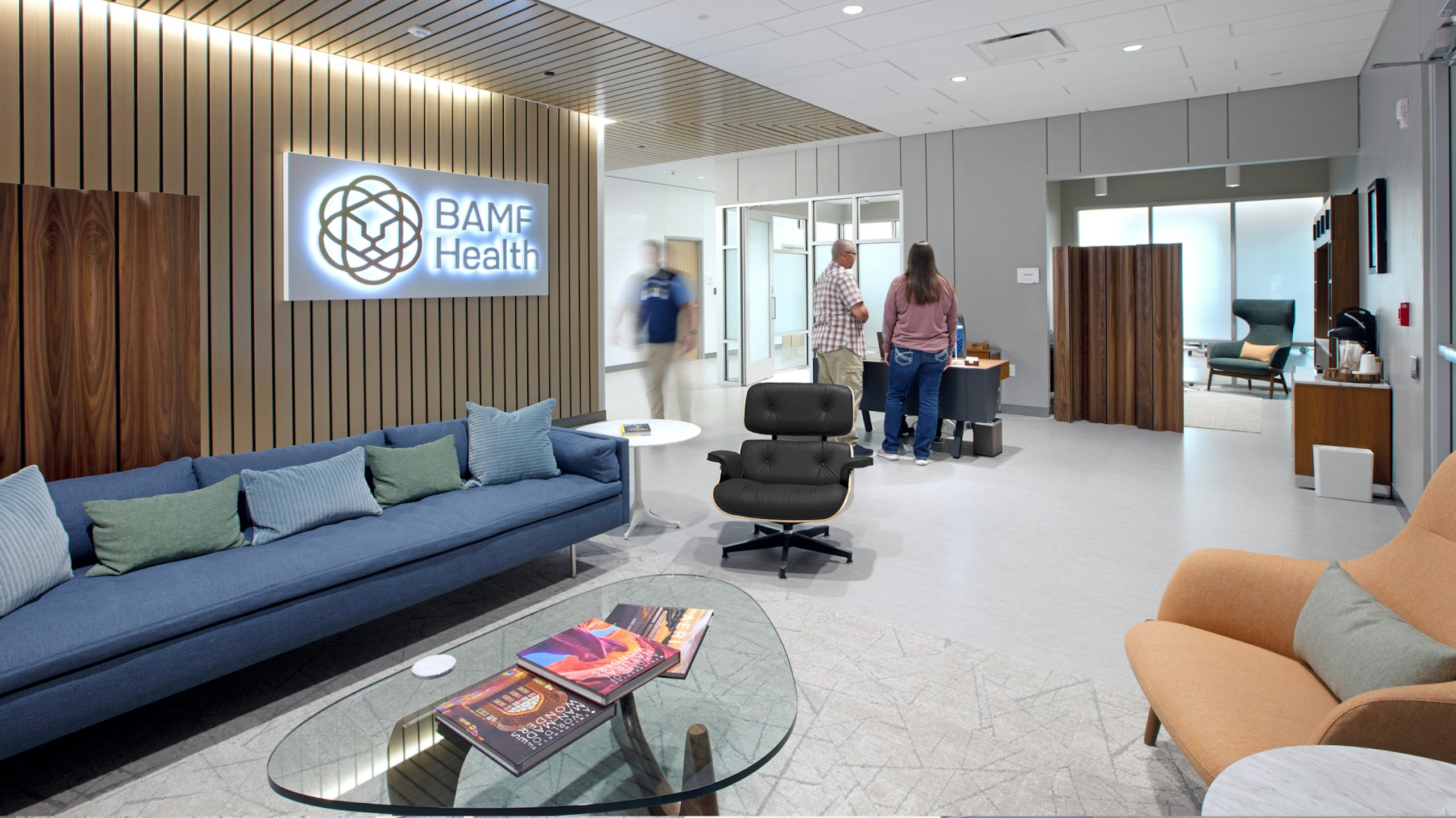 Reception and waiting area for patients with lounge seating and a reception station.
